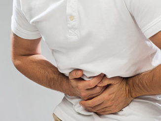 person holding stomach in pain epigenetics