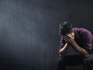 Man Holding Head Sad Depressed Epigenetics