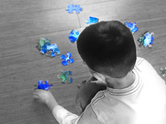 Child Playing With Puzzle Pieces Epigenetics