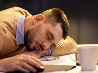 Man Sleeping on Desk